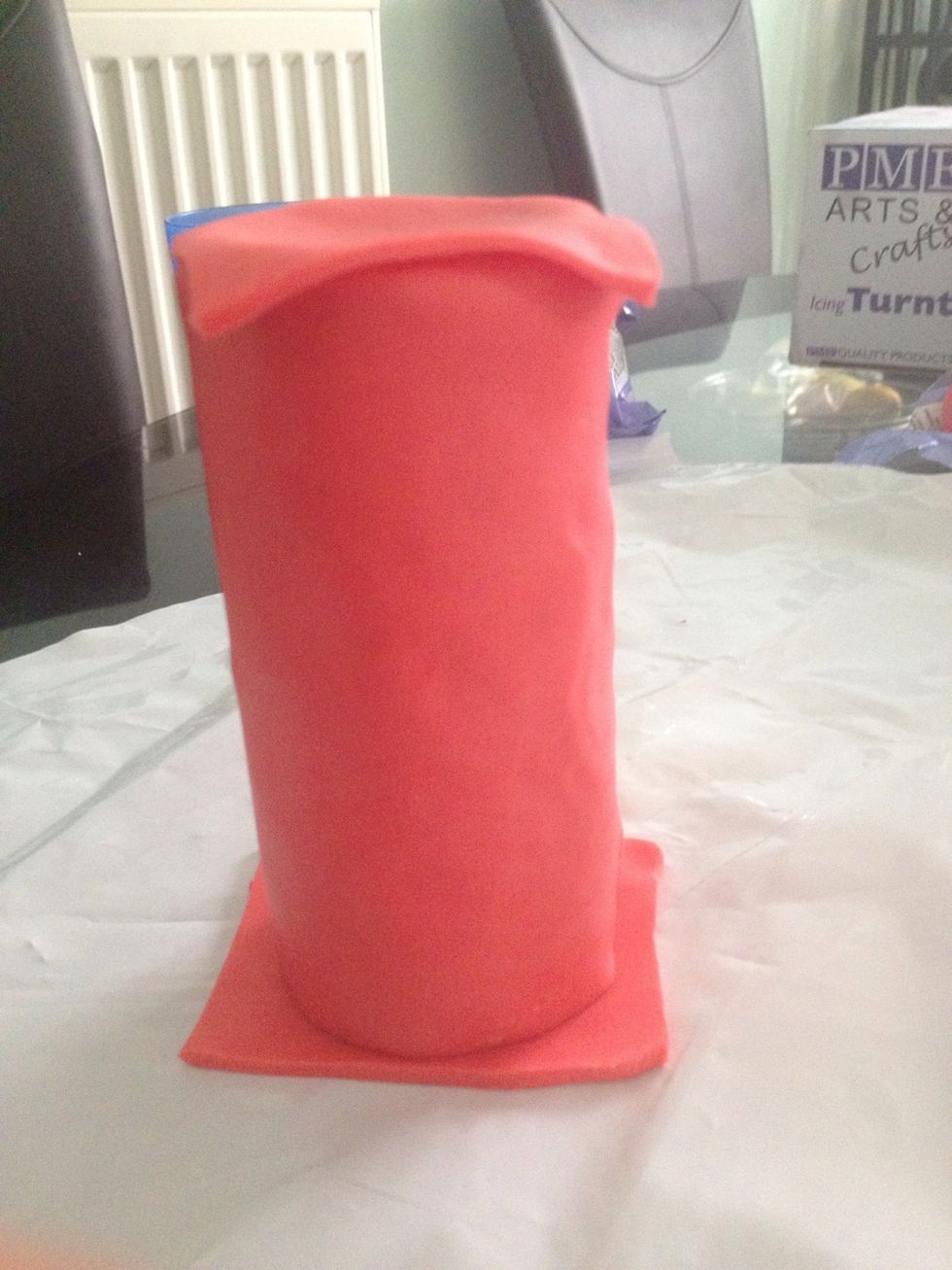 Fill the tube with icing to make it sturdy and stick the squares on the tube