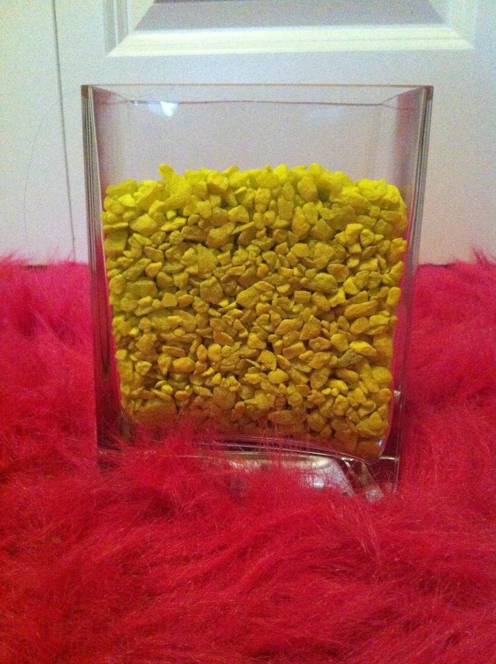 Fill the vase with the fishbowl rocks. You can use any color you like!