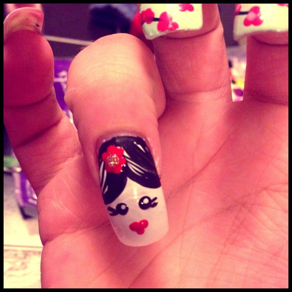 Fill the white polish with Red polish and add a gold dot in the middle