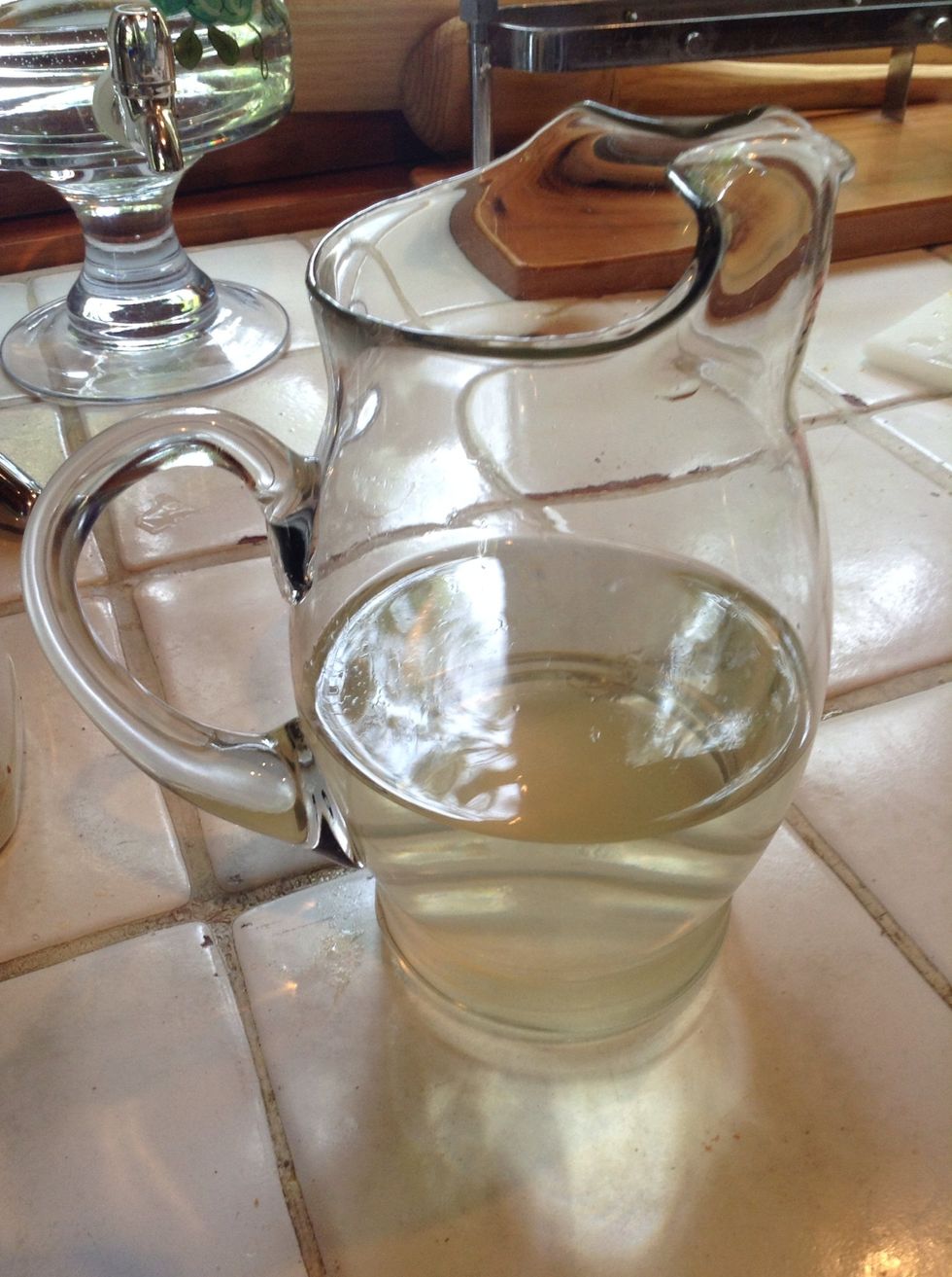 Fill till the half a carafe of water, and add the 6 tbs of sugar, mix it up!