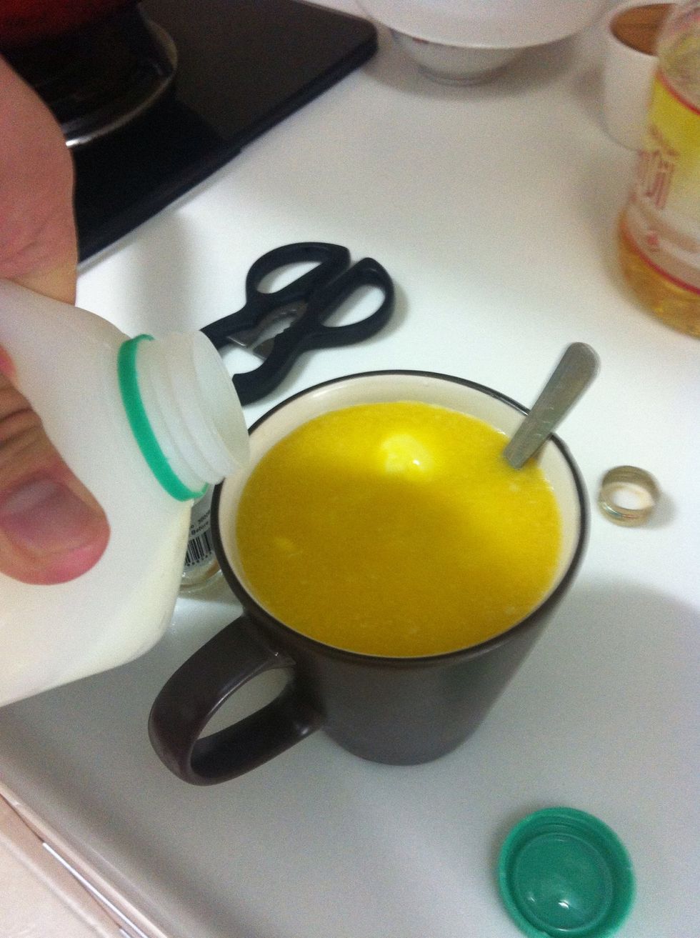 Fill up the cup with milk