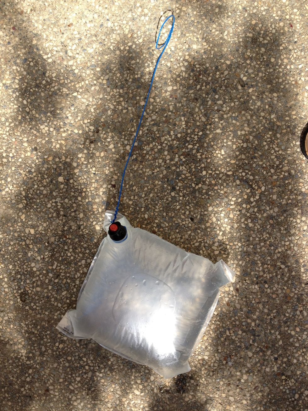 Fill up your bag with water by removing the valve again and then reinserting it after the bag is full.