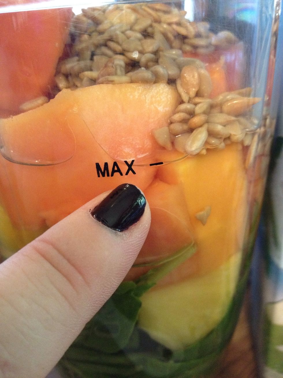 Fill up your NutriBullet to the max line with coconut water.