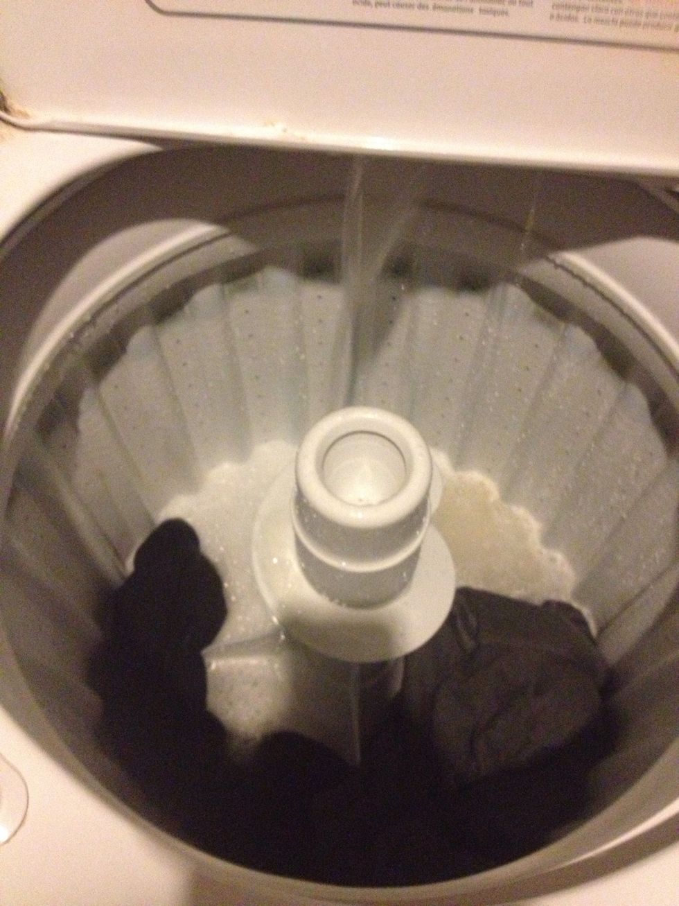 Fill washing machine (or sink, bucket) with hot water, add about a cup of conditioner to tub, let soak thirty minutes