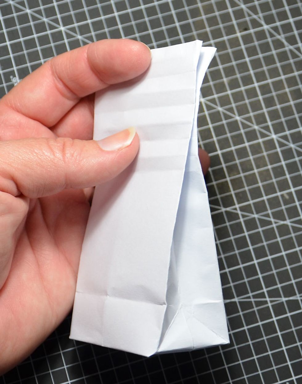 Fill with treats and then fold in the top of the bag as shown.