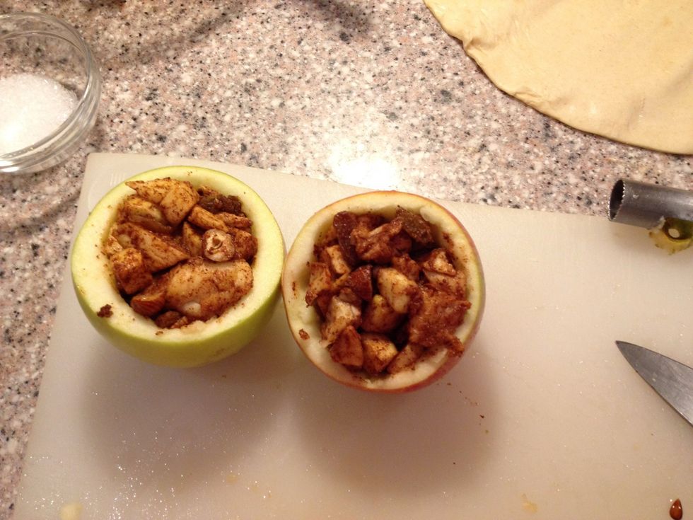 Fill your apples with the mix. All of the mix won't fit into your apples. Shame.