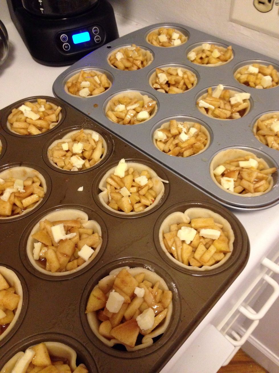 Fill your crusts with the apple mixture and place a few small pieces of butter on top of apples for extra flavor!