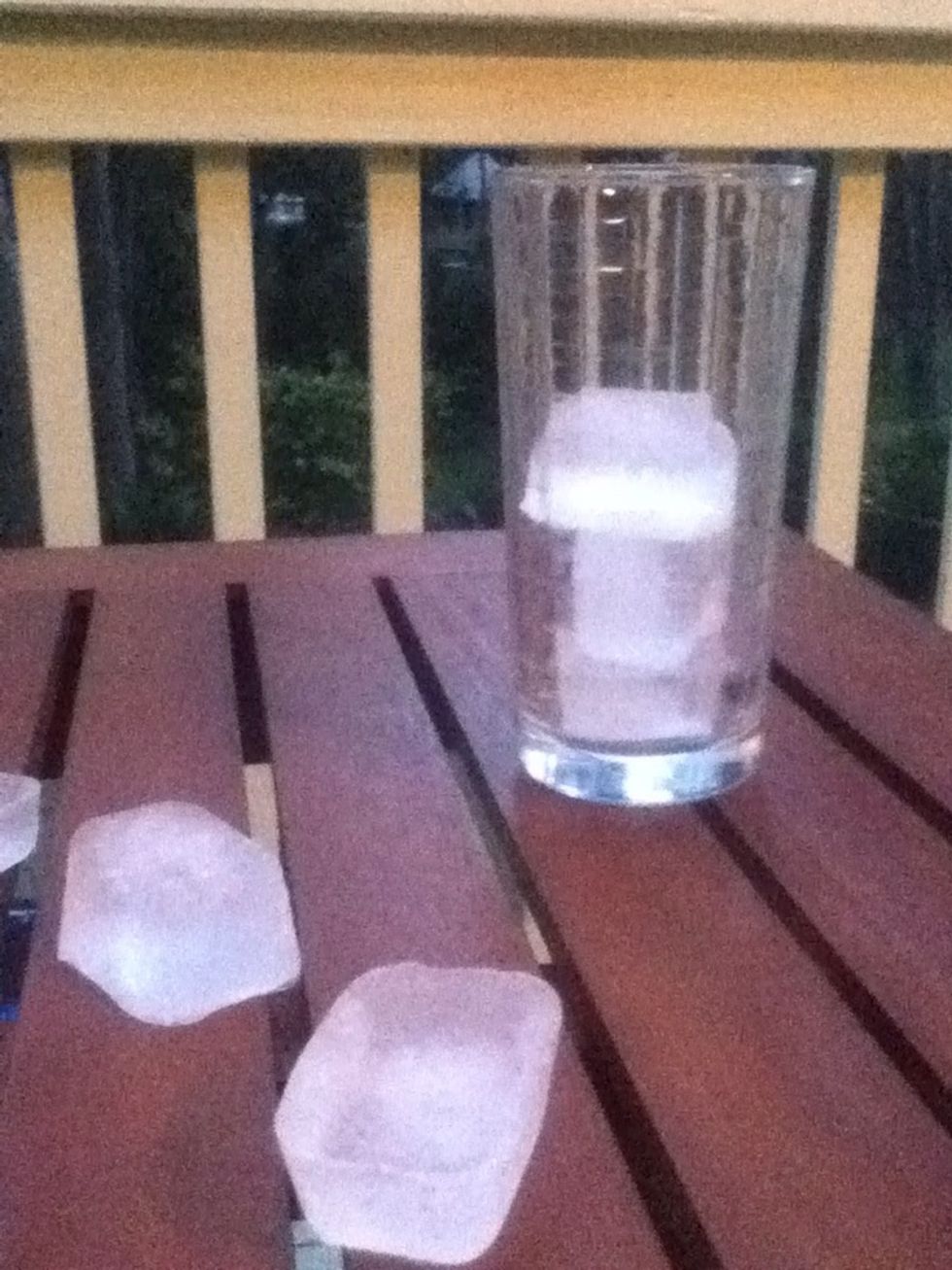 fill your glass cup half with ice cubes