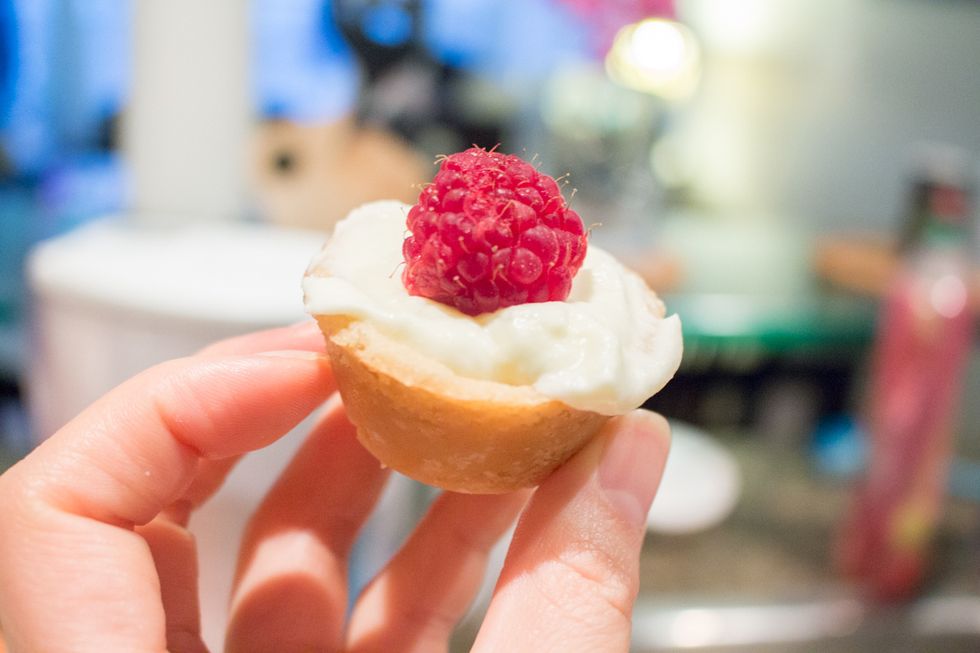 Fill your mini tartlets with the lemon curd mousse and top with a field berry.