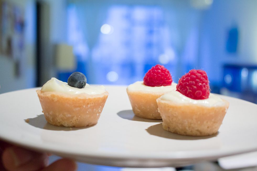 Fill your mini tartlets with the lemon curd mousse and top with a field berry.