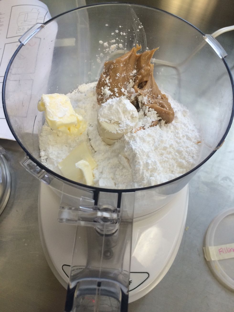 FILLING: Place icing sugar, peanut butter, butter, and a pinch of salt into a food processor.