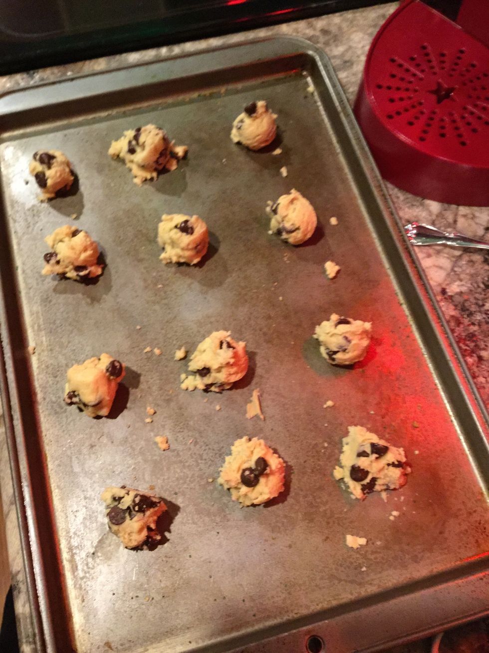 Filling the cookie scooper with chocolate chip cookie dough, put your cookie dough "balls" on the cookie pan. (Do not spray the pan)