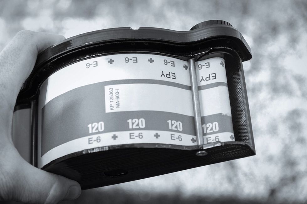 Film located in curved film plane. Print in ABS and vapour polish film plane - avoids scratching film emoultion.