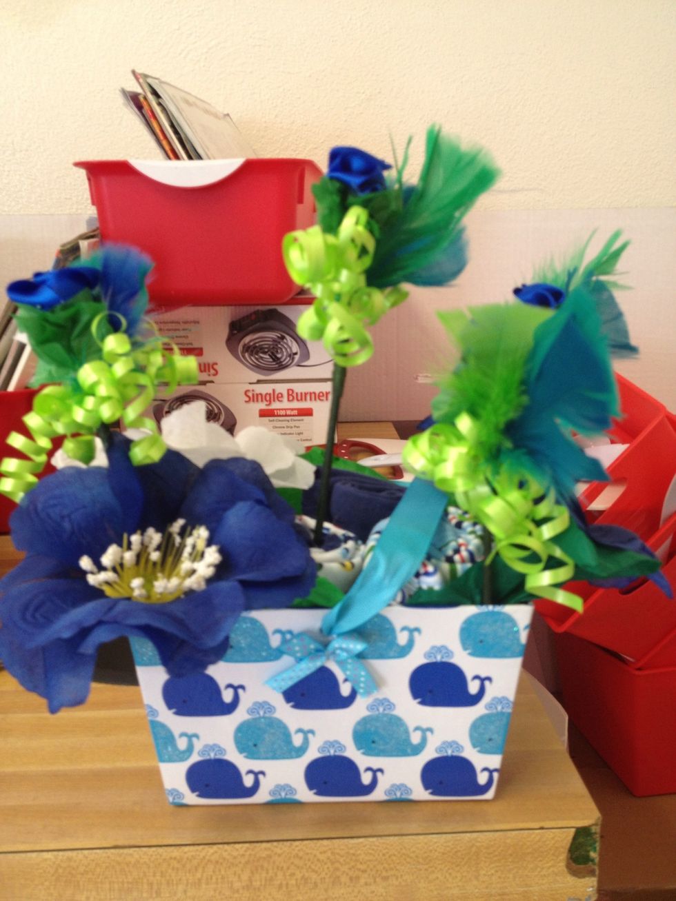 Final product ... I covered a skewer stick with floral tape added tissue strips and a rose made out of ribbon with some curled gift ribbon to add more umph