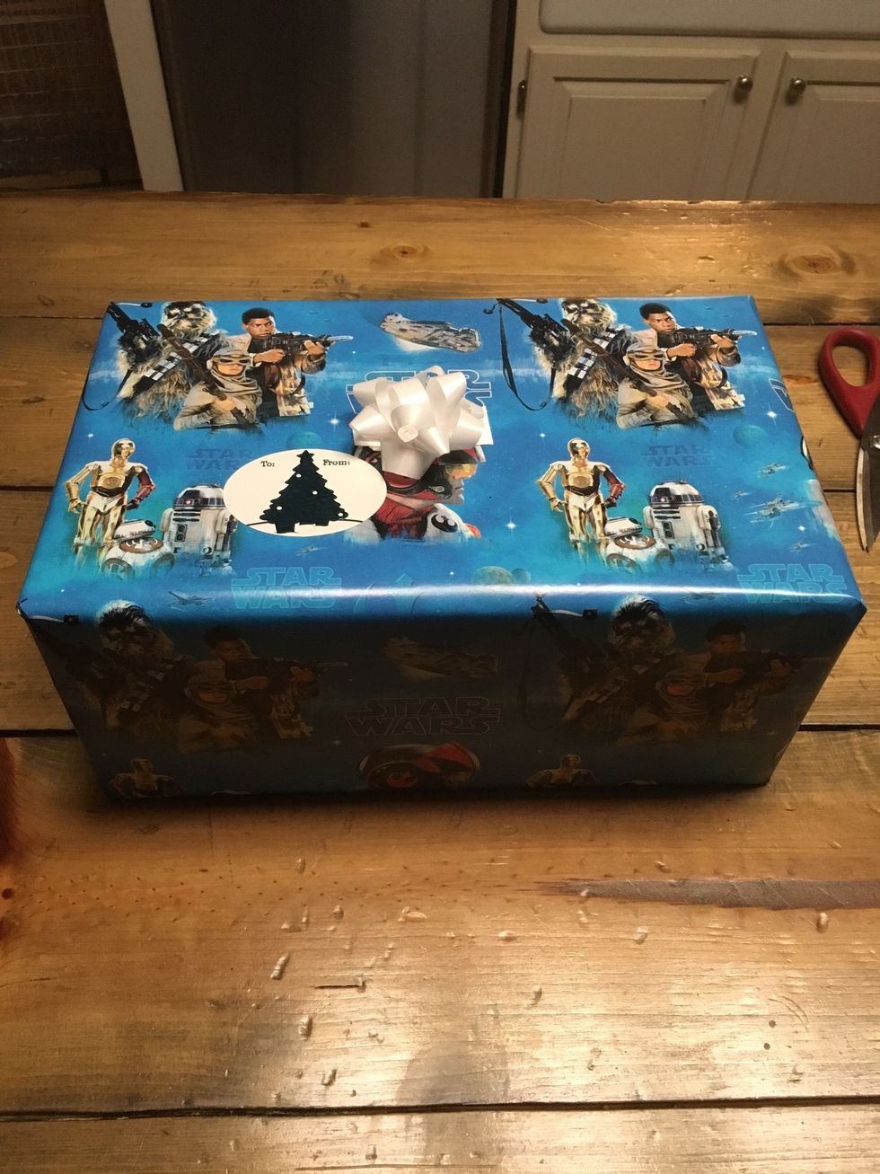 Finalize the gift by adding a bow and name tag anywhere you desire.