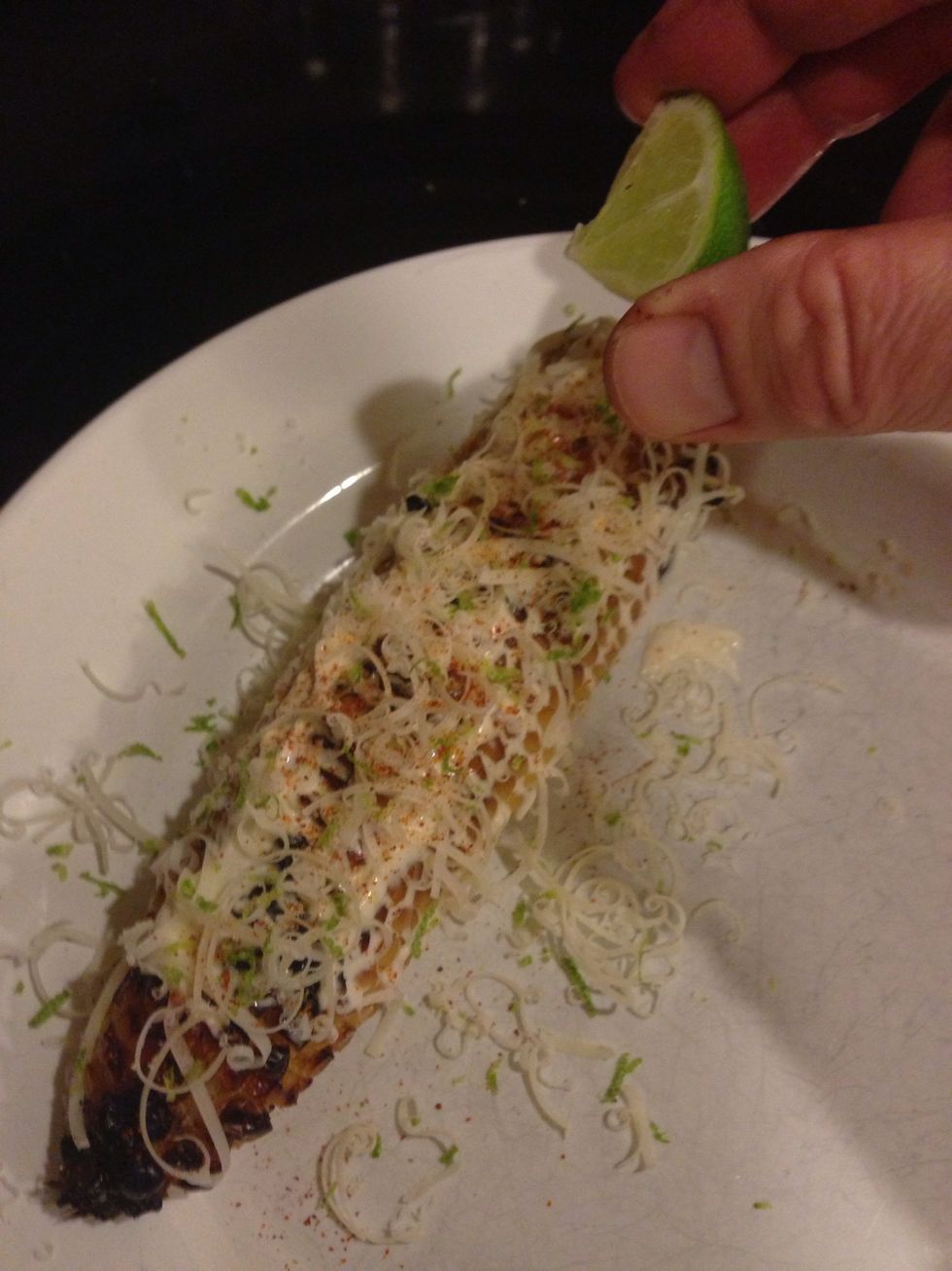 Finally, add a dusting of cayenne pepper. I like to use the remnants of the zested lime to squeeze some lime juice on the corn.
