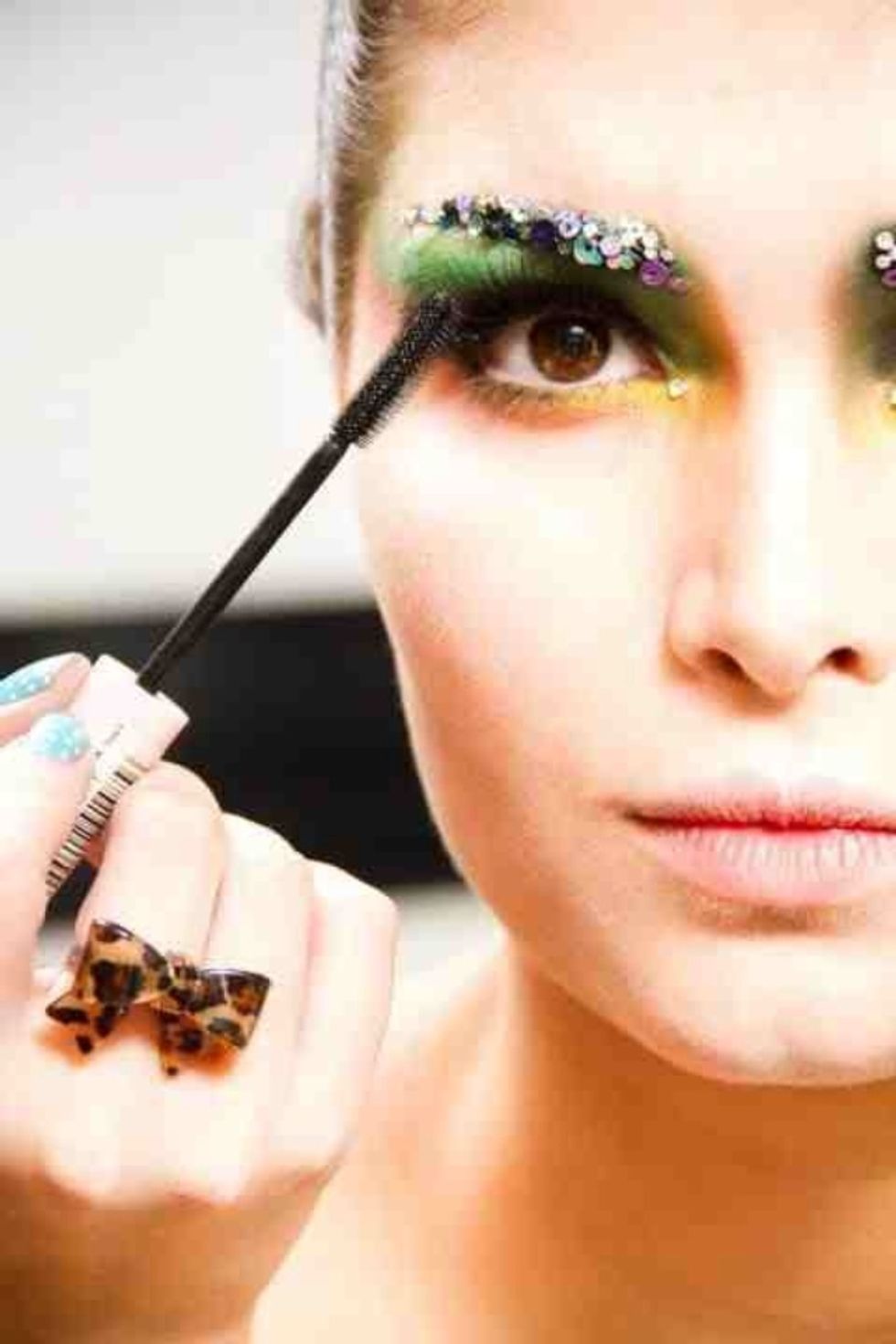 Finally add any final touches such as false eyelashes and mascara and you get amazing high fashion makeup with blocked eyebrows!