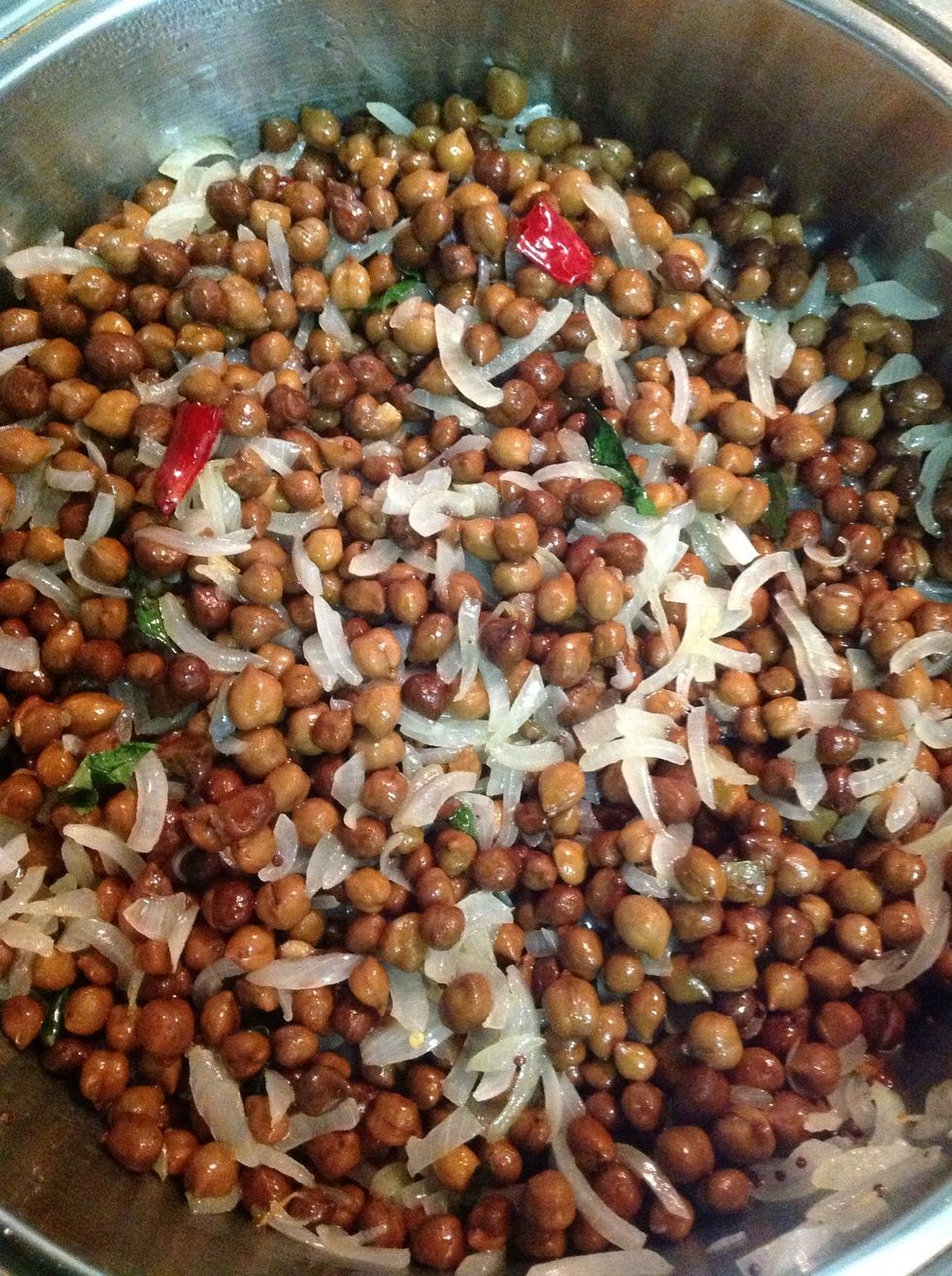 Finally add in drained chickpeas (drain off boiling liquid) and reduce heat and simmer gently in spices. This dish won't take time as the chickpeas are cooked. Serve on its own or with other curries