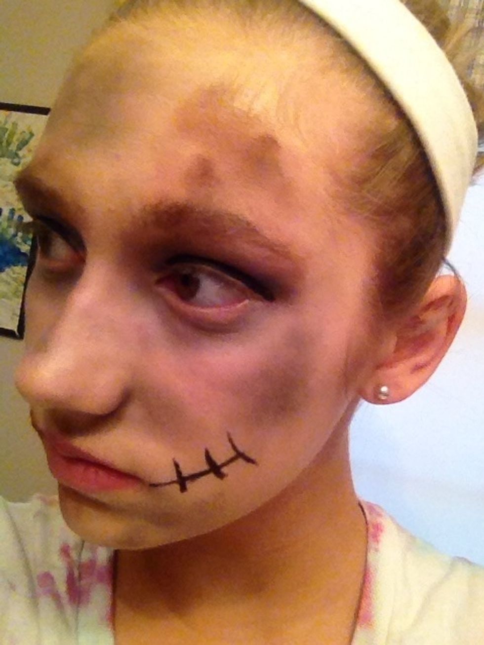 Finally add some brown eyeshadow to represent dirt on your face.