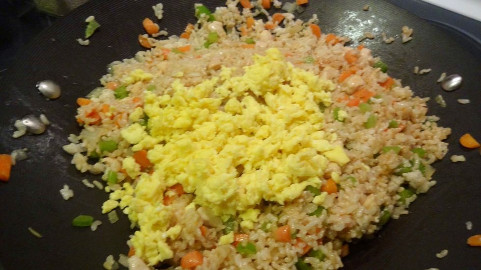 Finally add the eggs, 2 tbsp of soy sauce, a large dollop of garlic butter, and 1tbsp of sesame seeds.