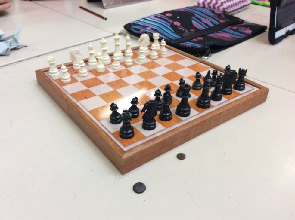 Finally add the king next to the queen.