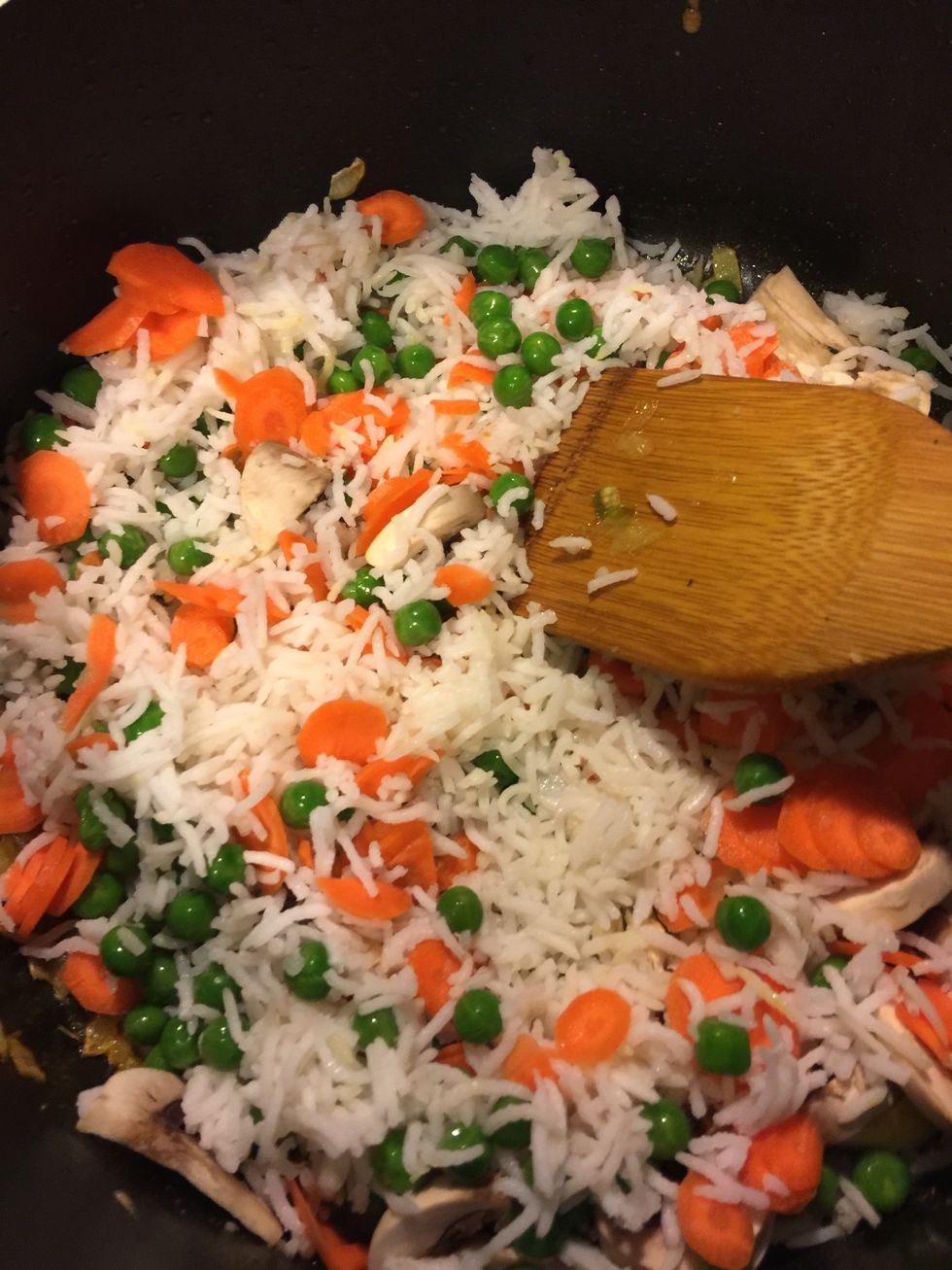 Finally add the rice and vegetables and mix well.