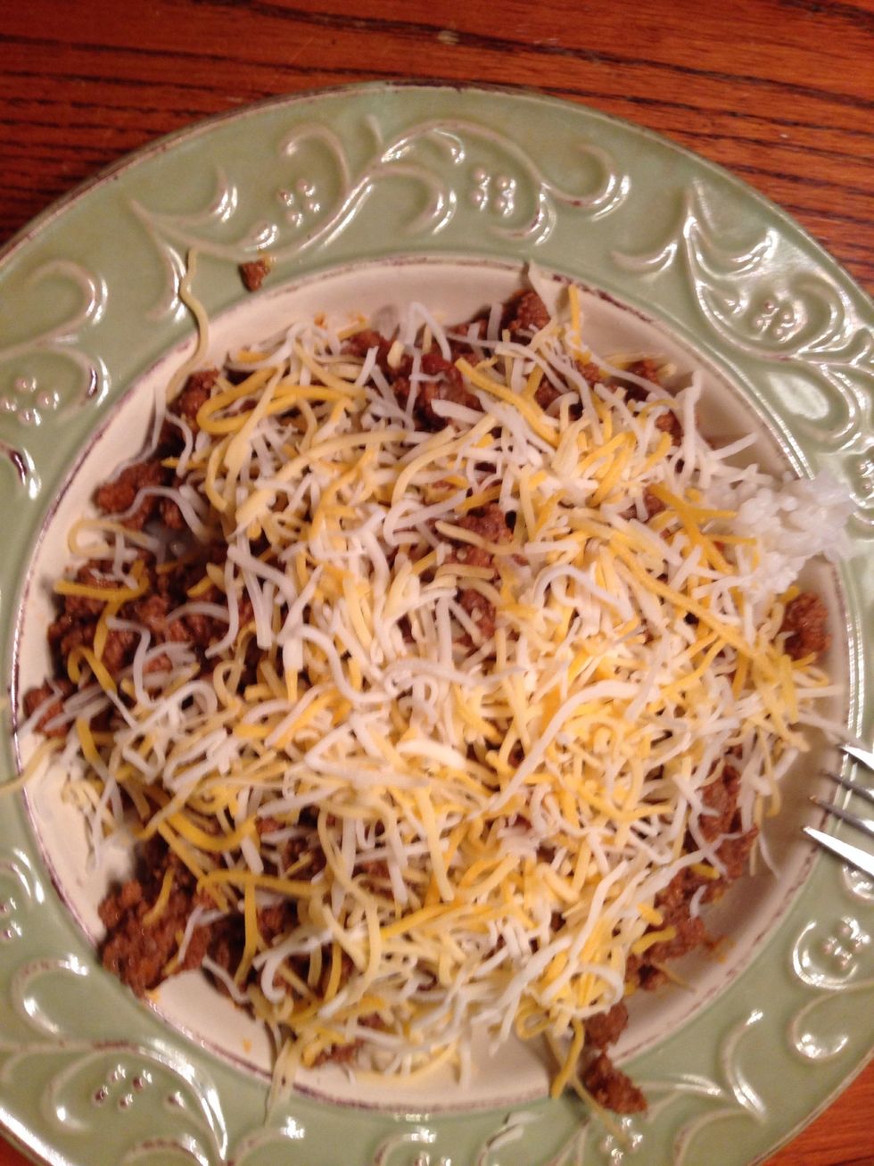 Finally add the shredded cheese. This is quick and flavorful meal. I have served this with corn chips and used the corn chips to scoop it up.