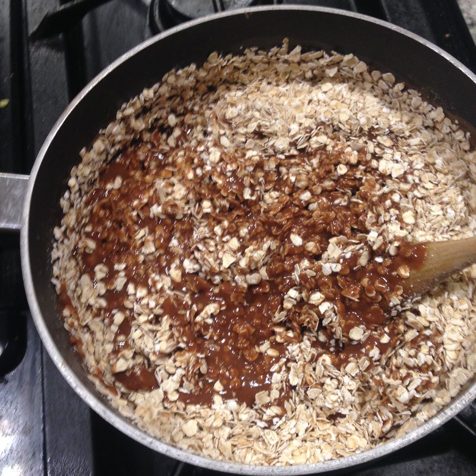 Finally, add three cups of oats and stir all together until the oats are covered with the chocolate mixture.