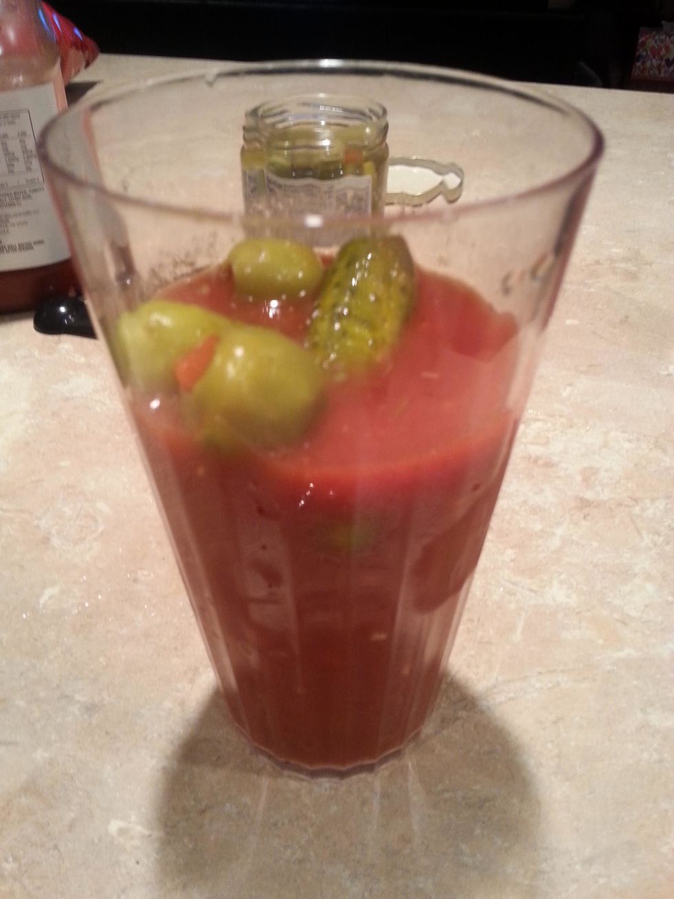Finally, add what ever garnish you would like. I used baby dill pickles and green olives.