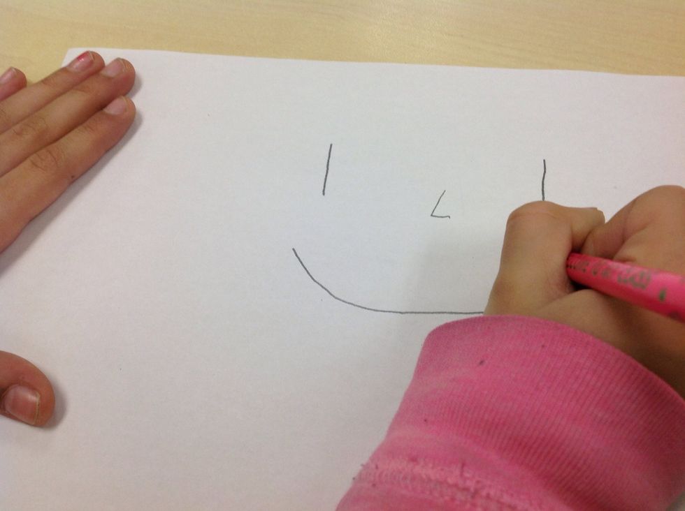 Finally,Draw a semi-circle on the piece of paper,Then draw a circle around the face and add some hair add a neck,clothes and hands.