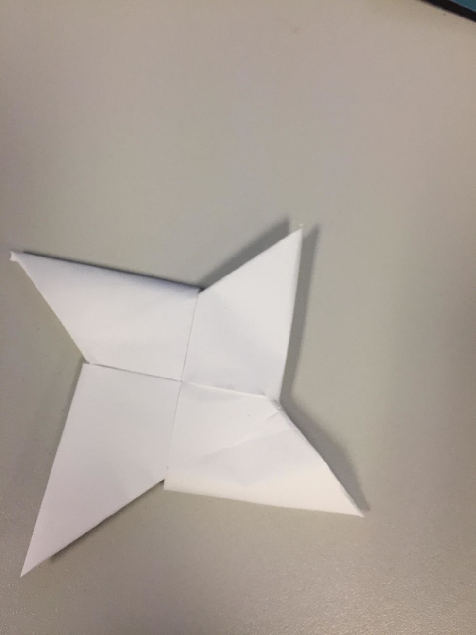 Finally fold the ends into the other opening to make a ninja star! =D