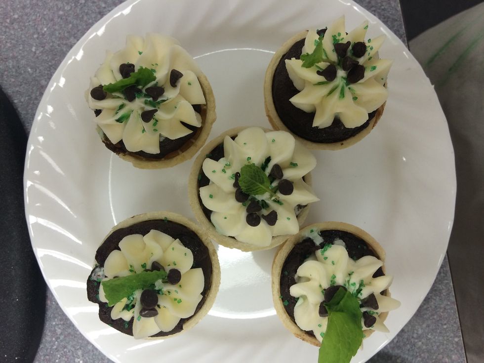 Finally, garnish off your cones with green sprinkles, mini chocolate chips, and a single mint leaf. Now, its time to kick back, relax, and share your delicious treats with everyone!