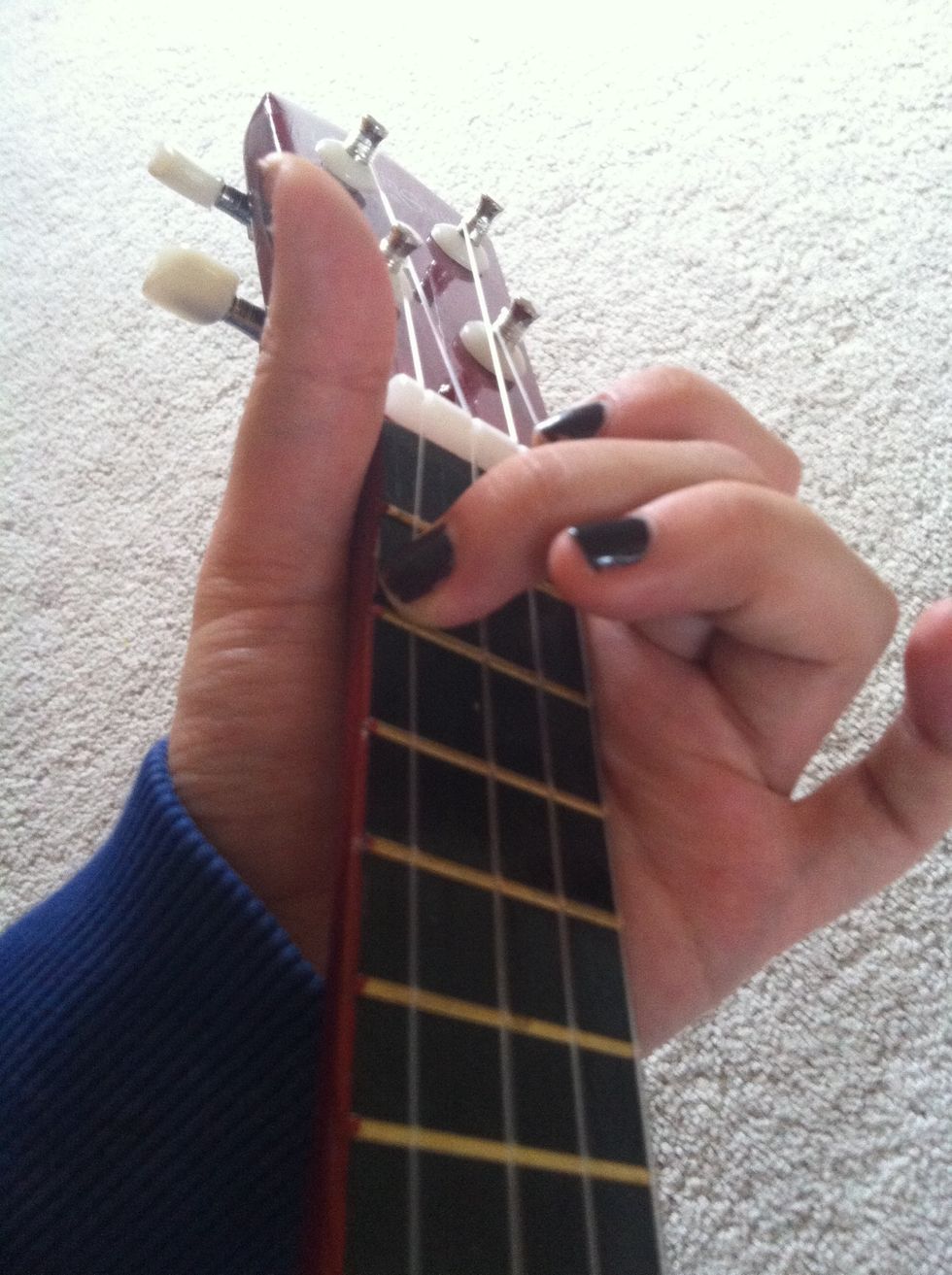 Finally, hold down the 2nd fret of the 1ST string and tune the last string accordingly. The last string is A(4).