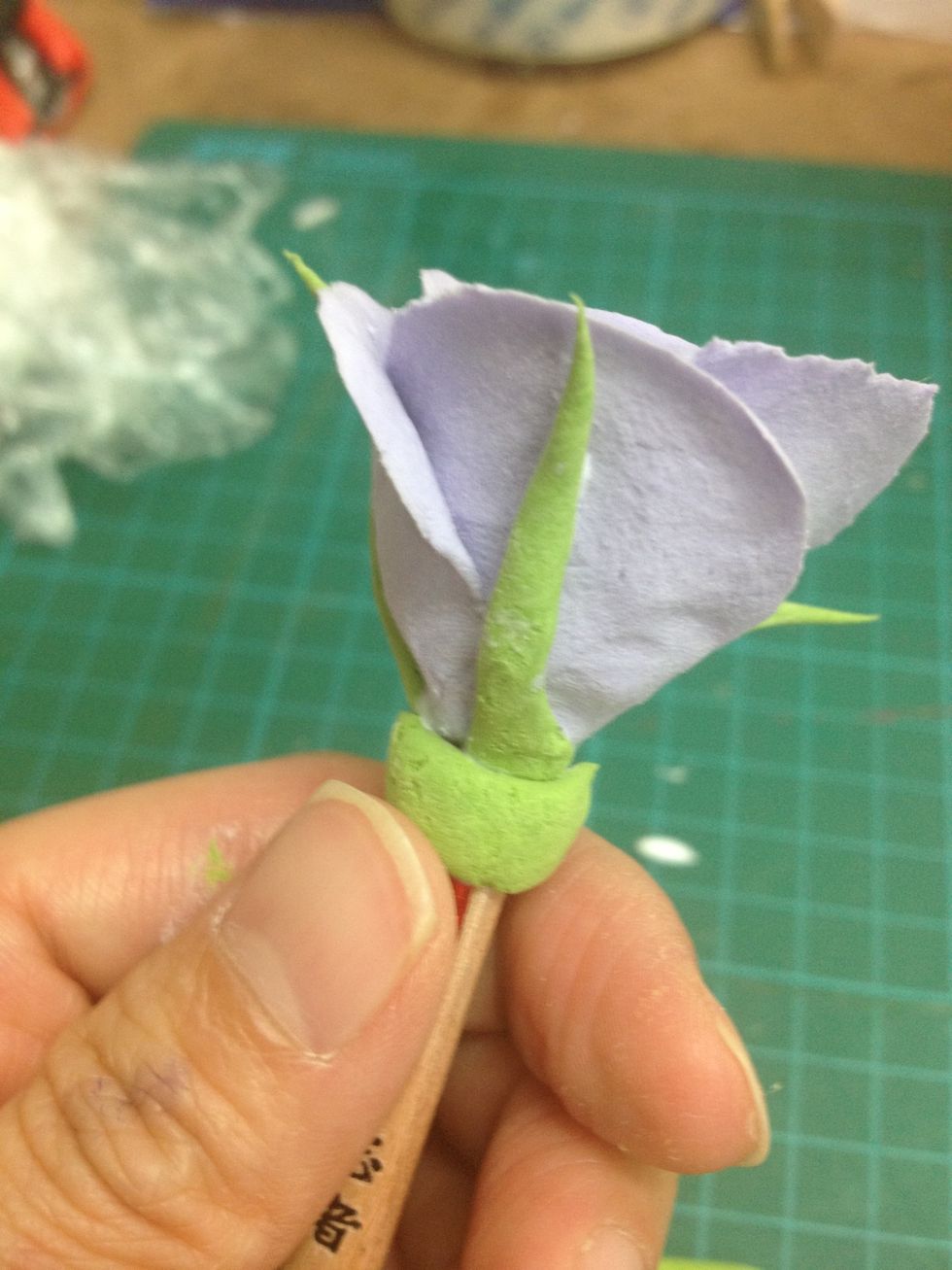 - Finally, make a green line round the bottom of the rose. Remember to use white glue to glue on.