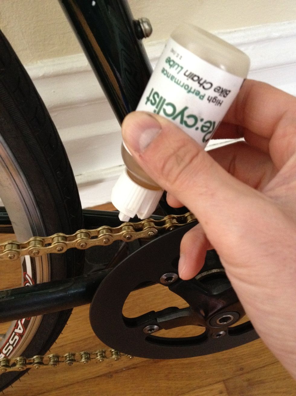 Finally, place a drop of chain lube in all of the links of the chain and wipe the excess off with a rag. Now you're ready to ride again!