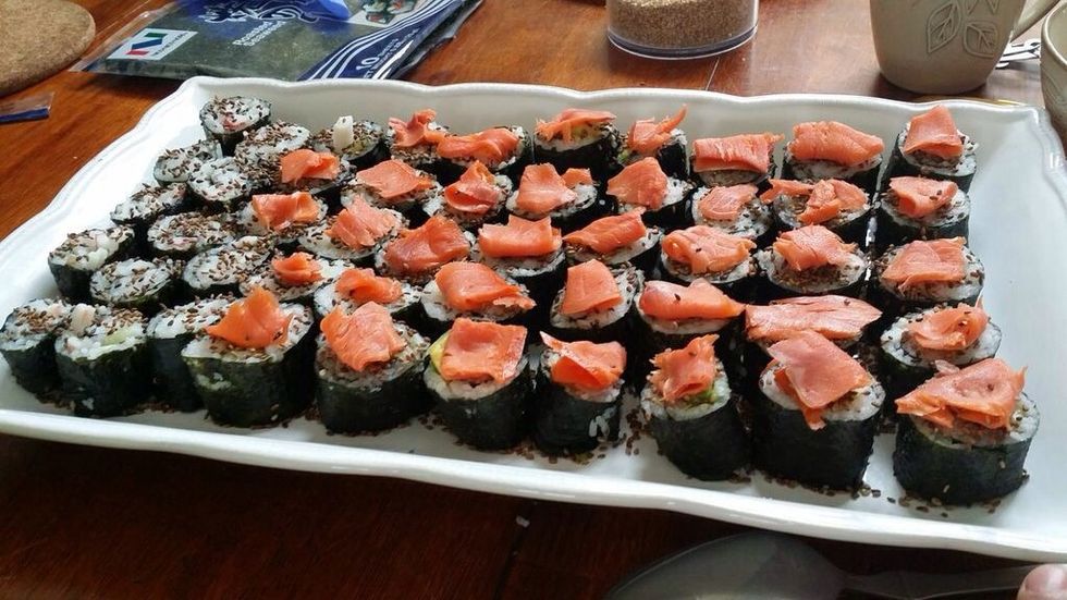 Finally, place one slice of smoked salmon on each sushi roll. I like to leave a small portion of the sushi without any salmon, for anyone who is not comfortable with eating it.