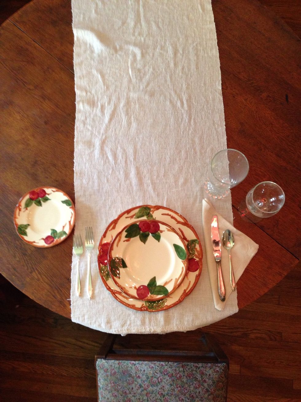 Finally place the bread plate to the left of the forks and slightly above them as shown.