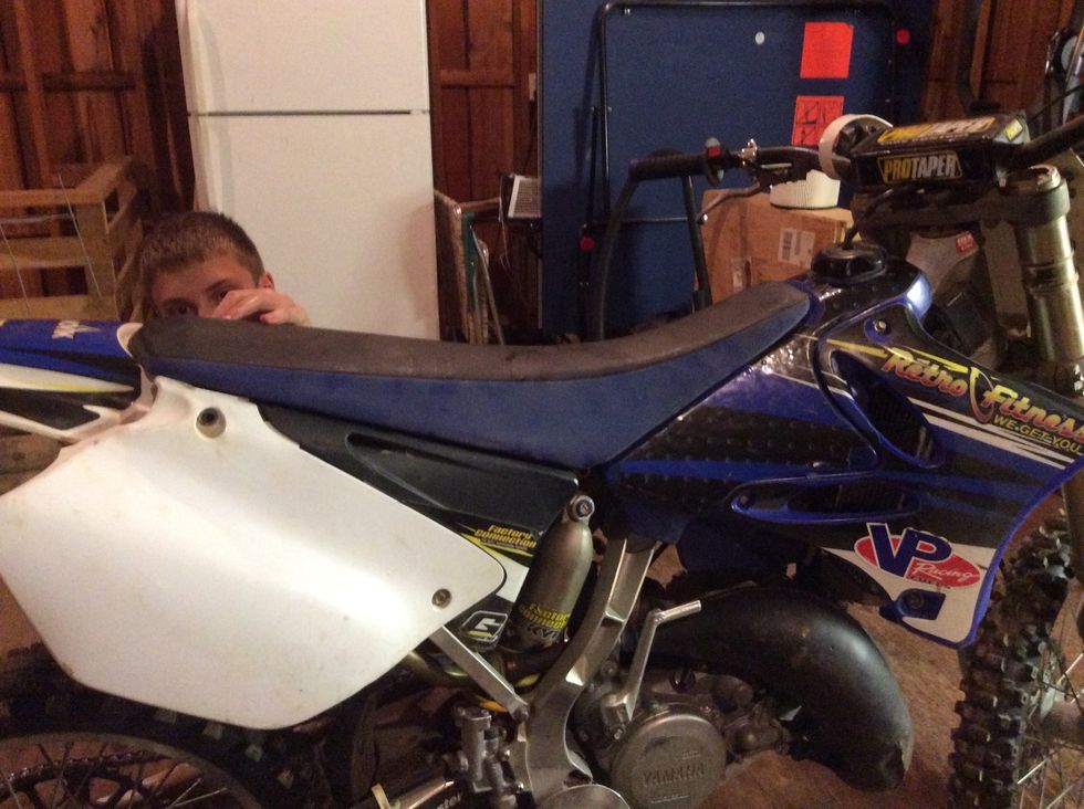 Finally, put the bolts back in to hold the seat. Make sure that the grove on the top of the seat is lined up properly with the part on the bike.
