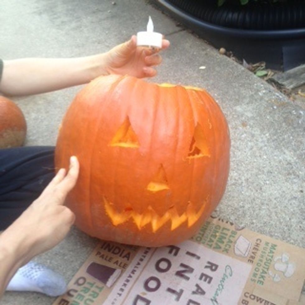 Finally put the candle in the pumpkin.