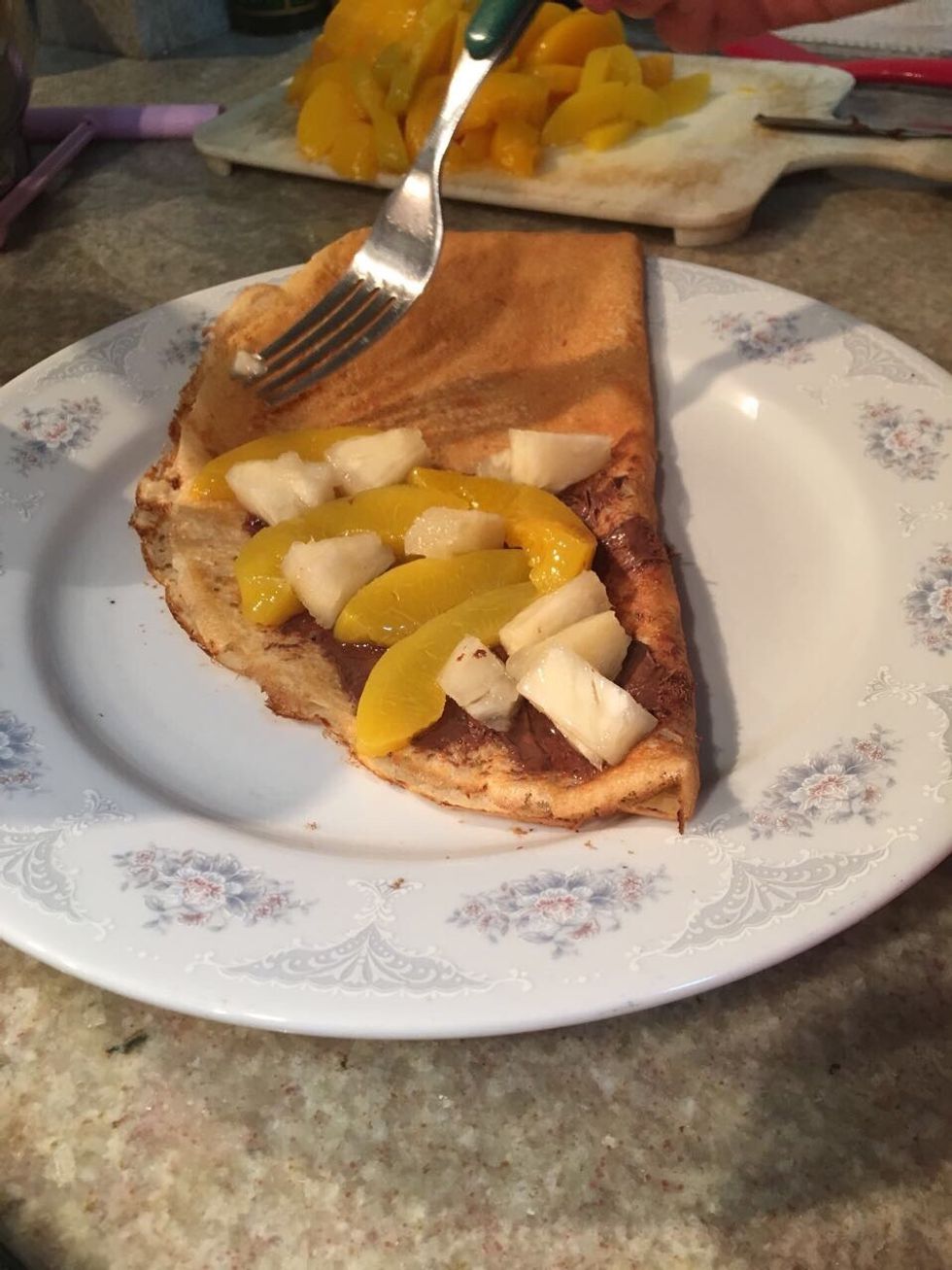 Finally put the ingredients that you want like Nutella, peaches and pineapple