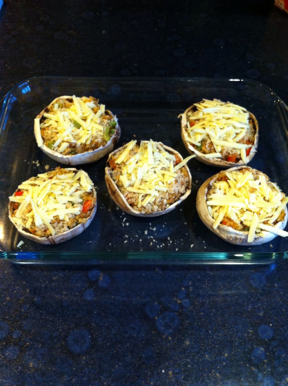 Finally... Sprinkle some grated cheese onto each mushroom.. Then place in the oven for 20 minutes at 200 degrees Celsius (or until the cheese is golden brown)