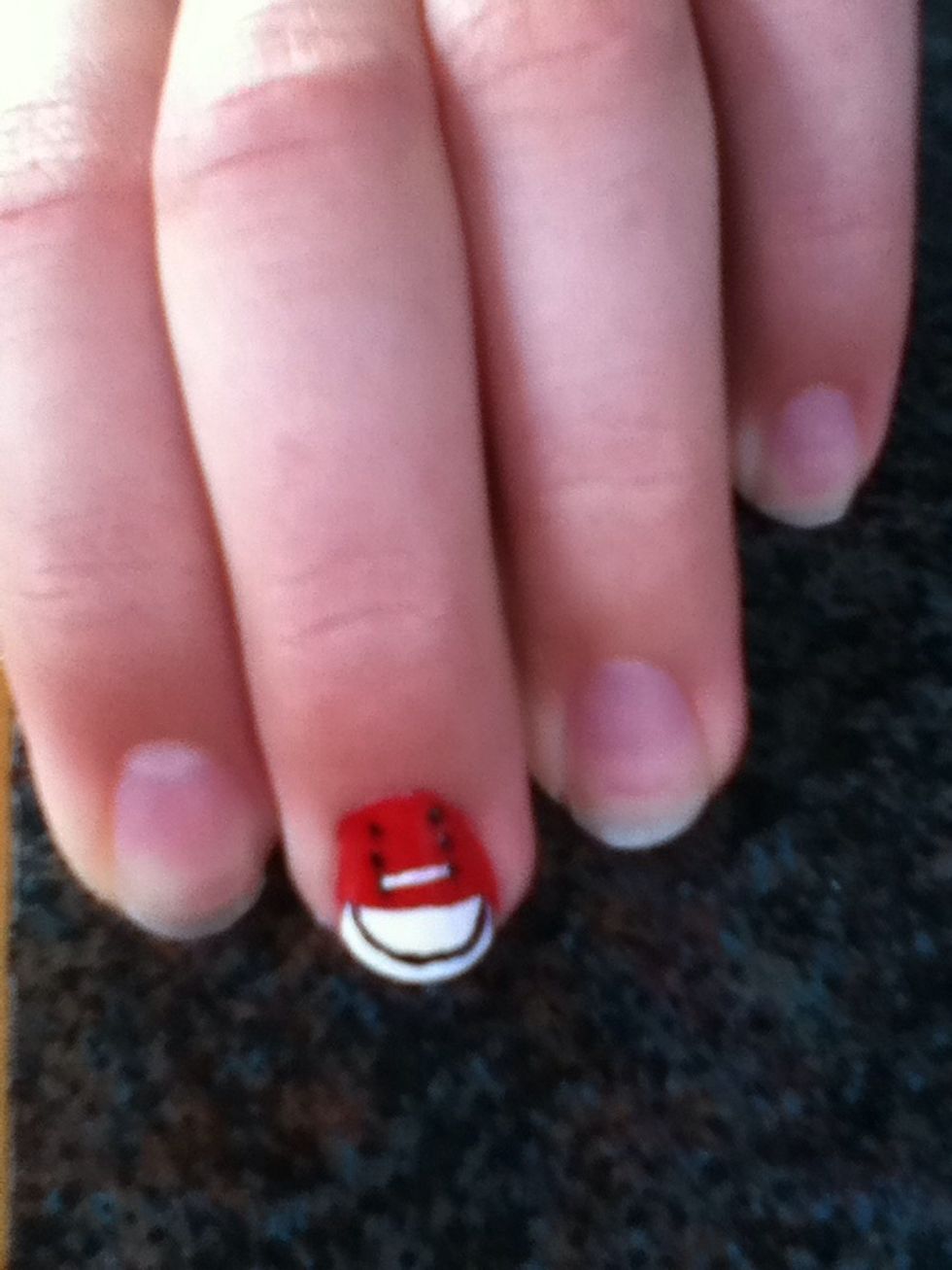 Finally start the laces by painting a line connecting the top dots and then criss crossing down