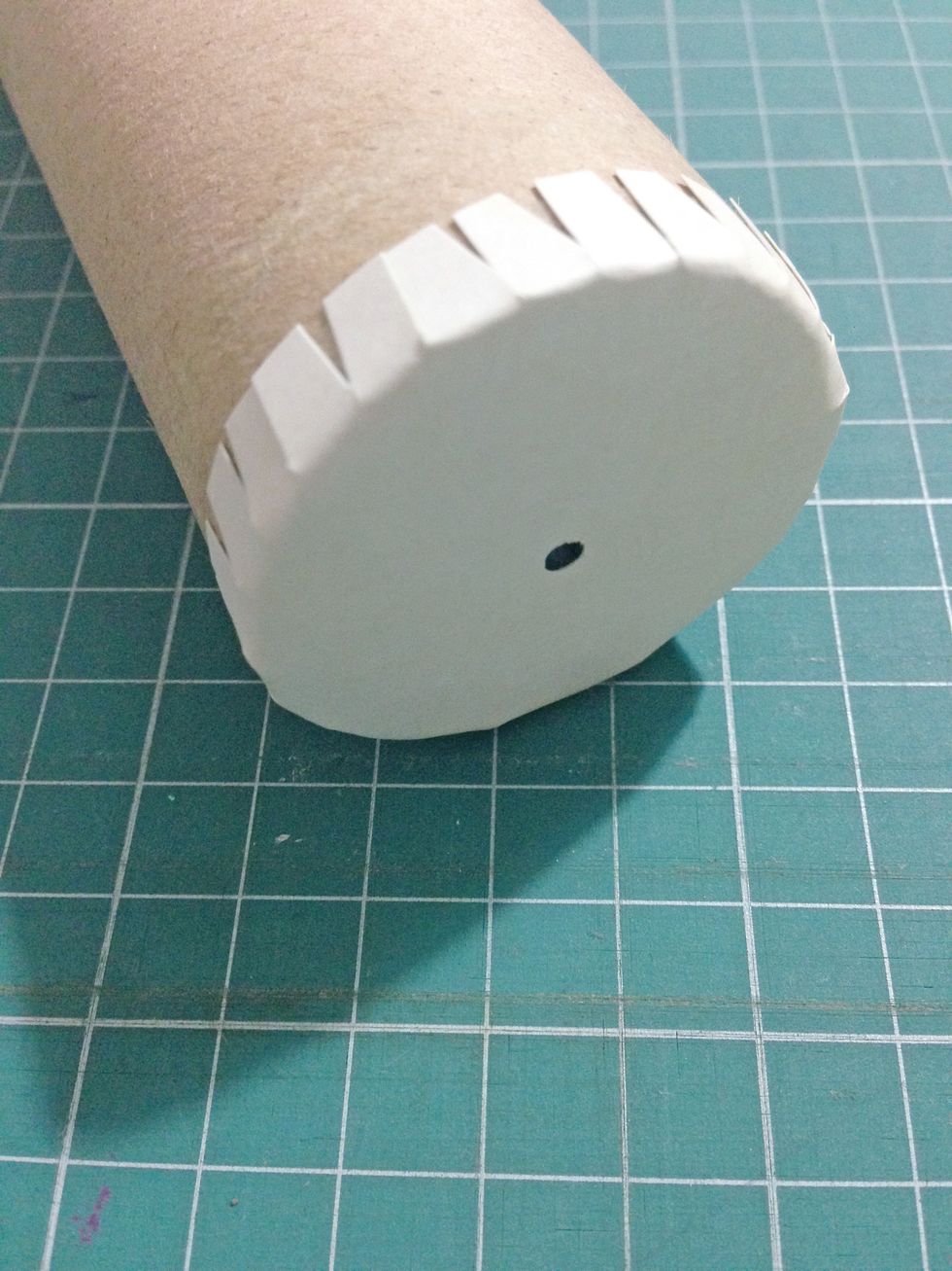 Finally, tab around the last circle (with hole in the center) and adhere down to the kitchen... This will be the peeping hole of the kaleidoscope...