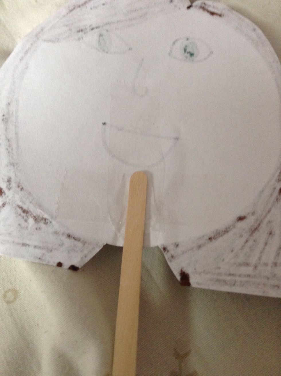 Finally,tape the Popsicle stick/straw on the back of your puppet and your finished.