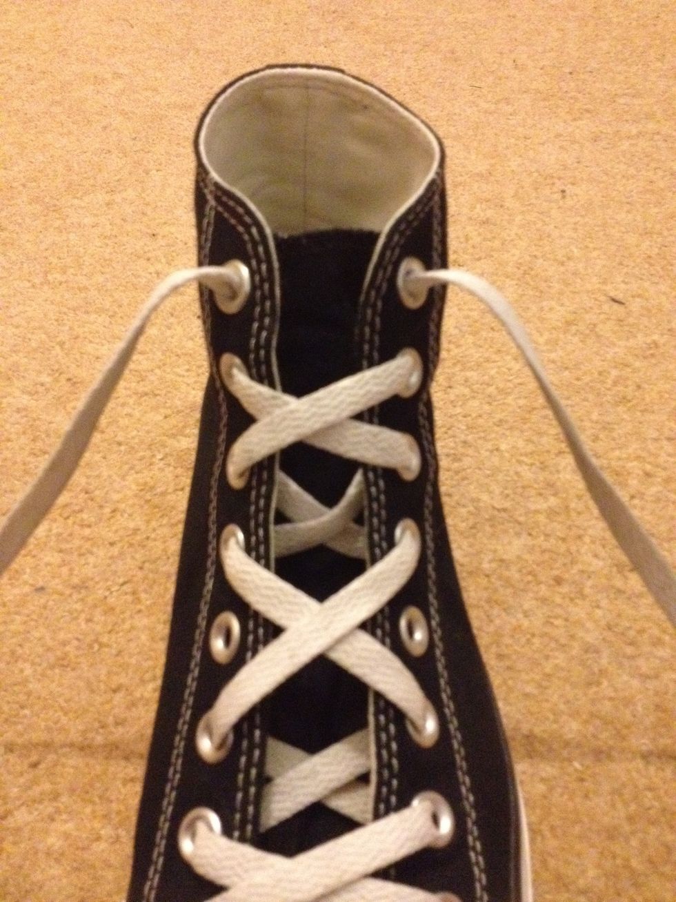 Finally, tidy up by bringing each lace straight up to the top eyelets.