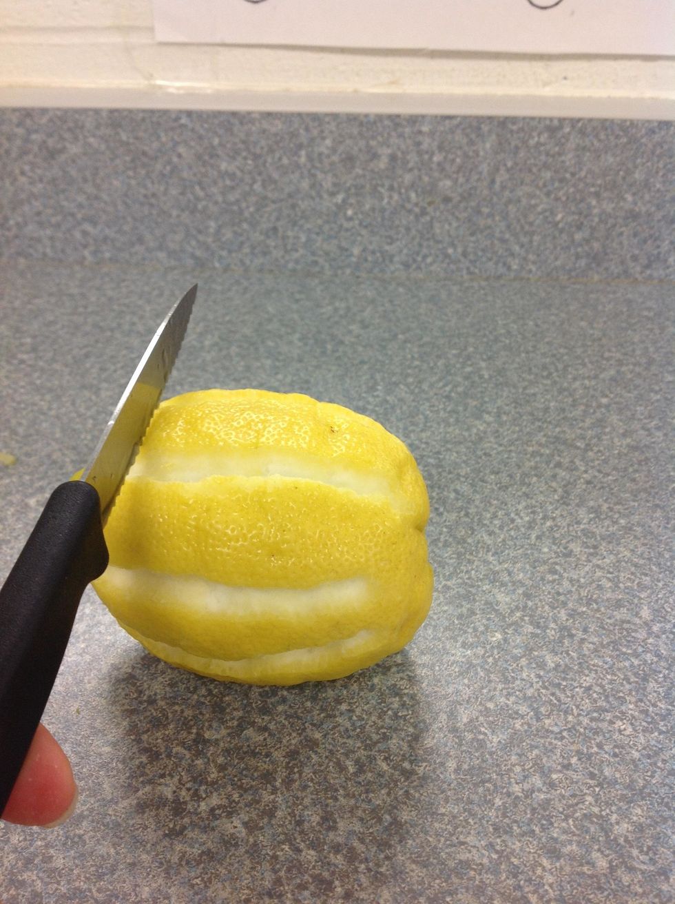 Finally, you take your knife and cut your lemon in nice, neat, thin, slices.