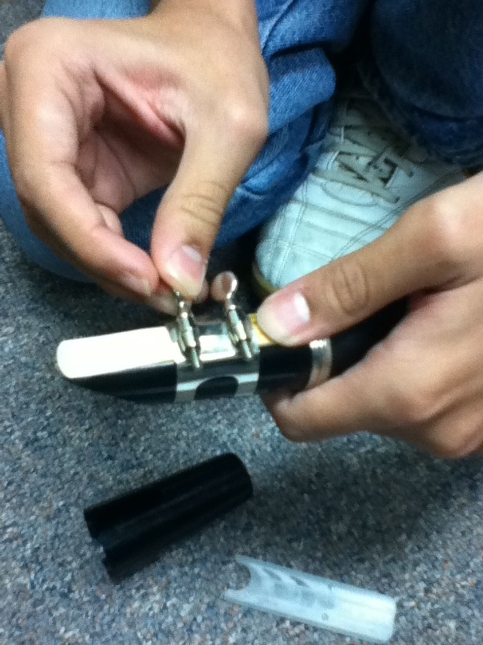 finaly put the legature on the reed and mouth piece. make sure to screw the legature.