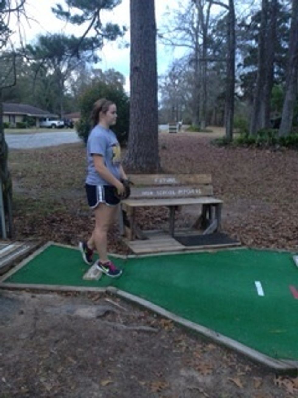 Find a comfortable stance with your right foot in front and your left foot behind.