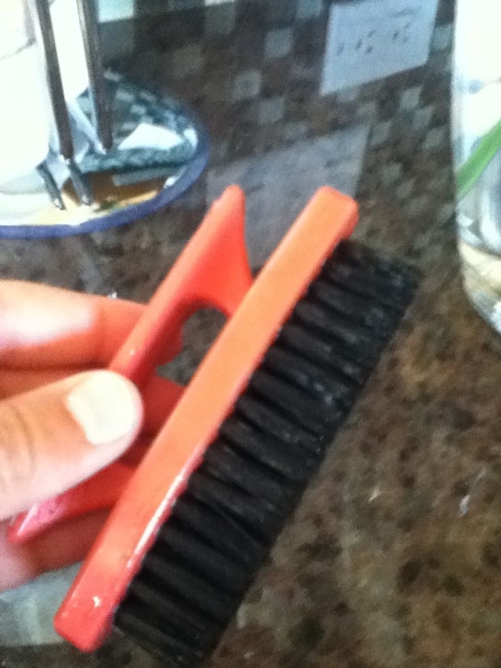 Find a good, sturdy, rough brush to brush your shoes with