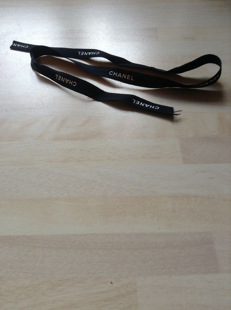 Find a length of ribbon you like. I had this short amount of ribbon from a bottle of perfume.